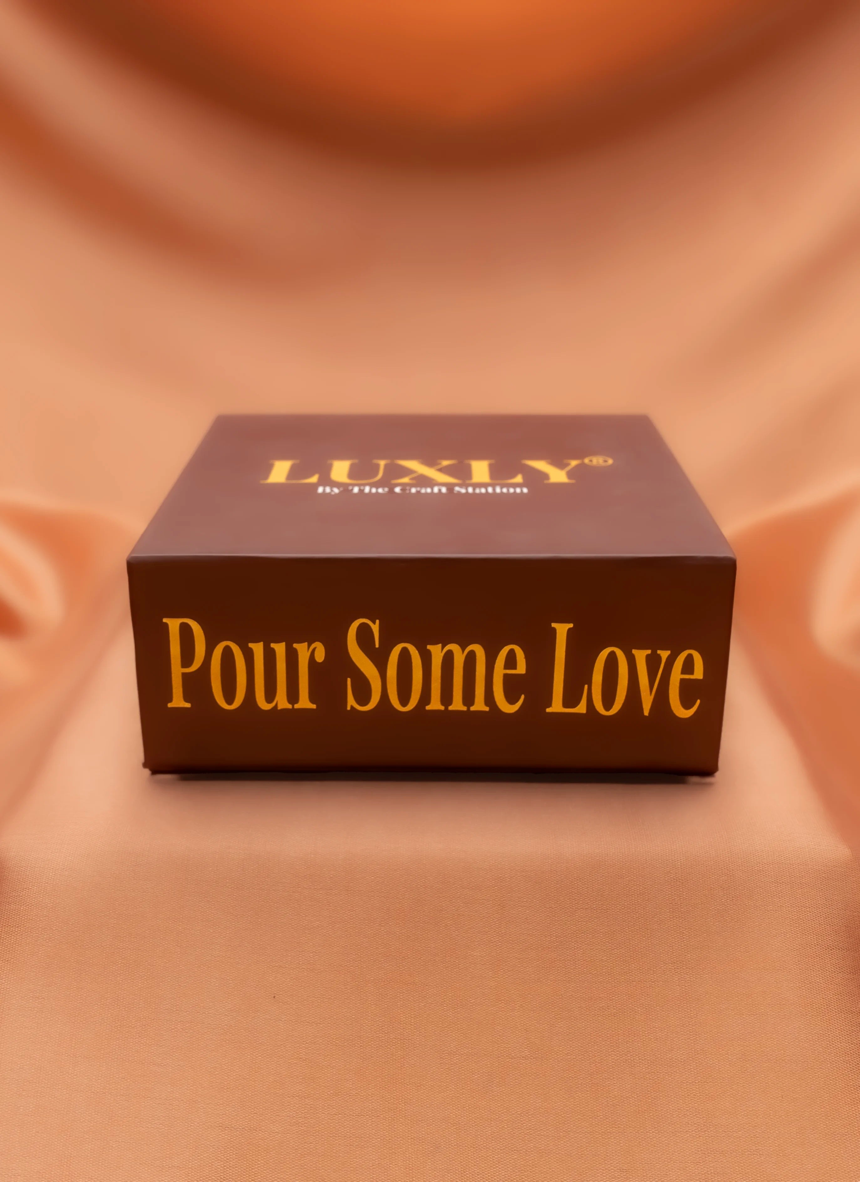 Luxury product packaging with 'Pour Some Love'