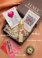 Luxly gift set with apology scroll, flower in a bottle, secret message candle, and QR message card.