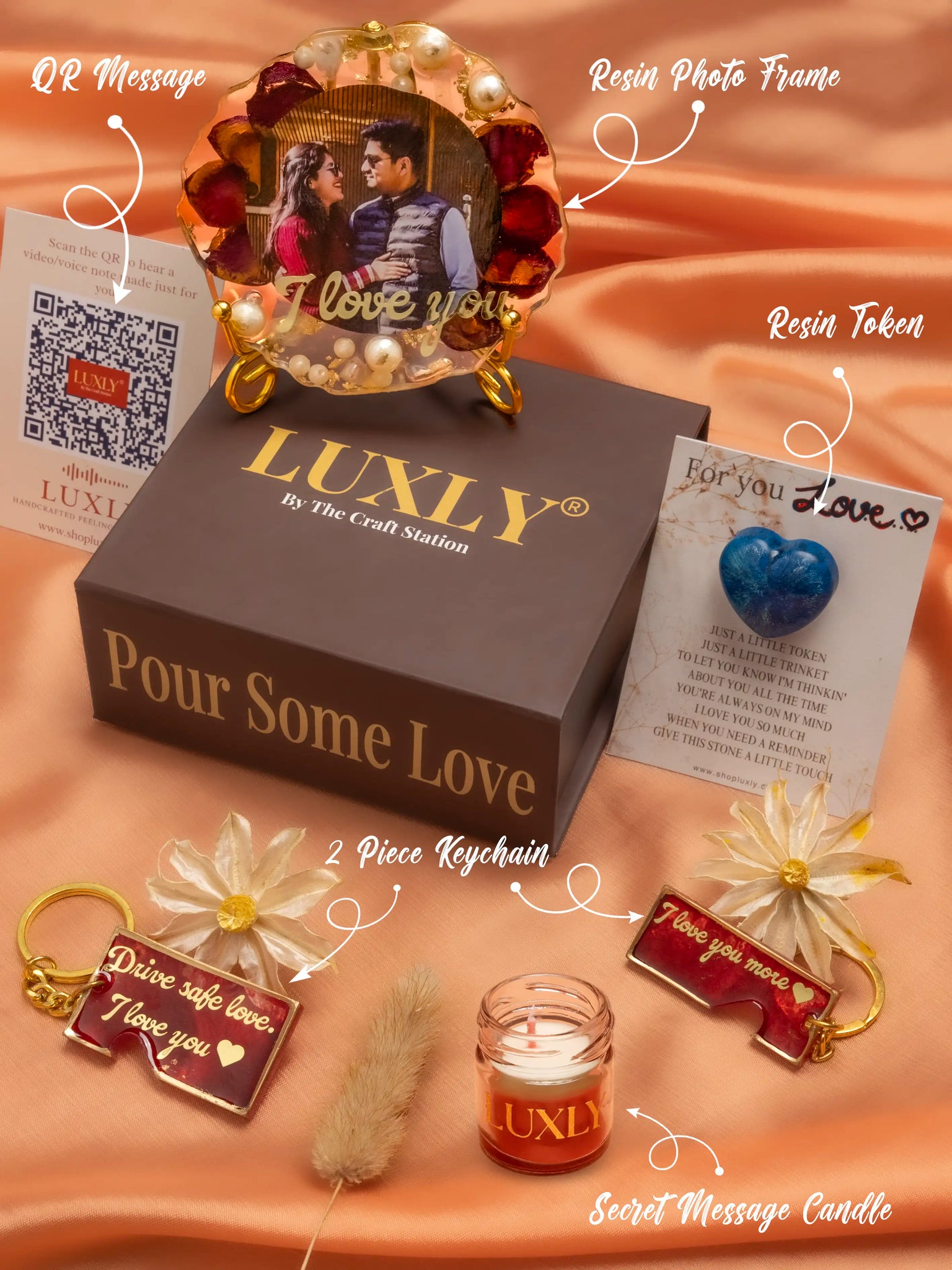 Luxly product set with resin photo frame, keychains, candle, and token 